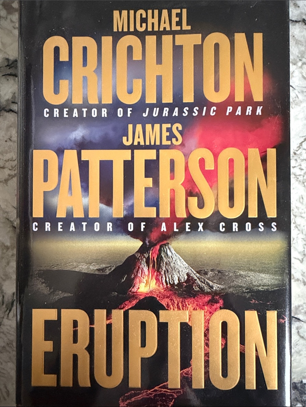 Eruption by Michael Crichton & James Patterson - Black/Gold Hardcover